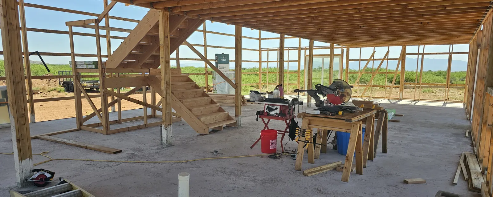 Open timber-frame structure on the off-grid homestead build site near Tombstone, Arizona