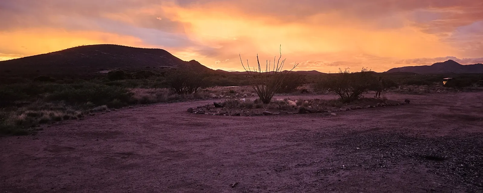 Red and orange sunset sky over a desert ridge in Arizona