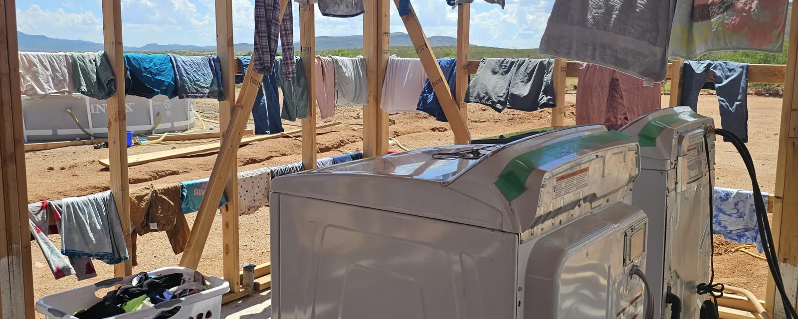 Solar-powered work area with a washing machine inside the off-grid build near Tombstone, Arizona